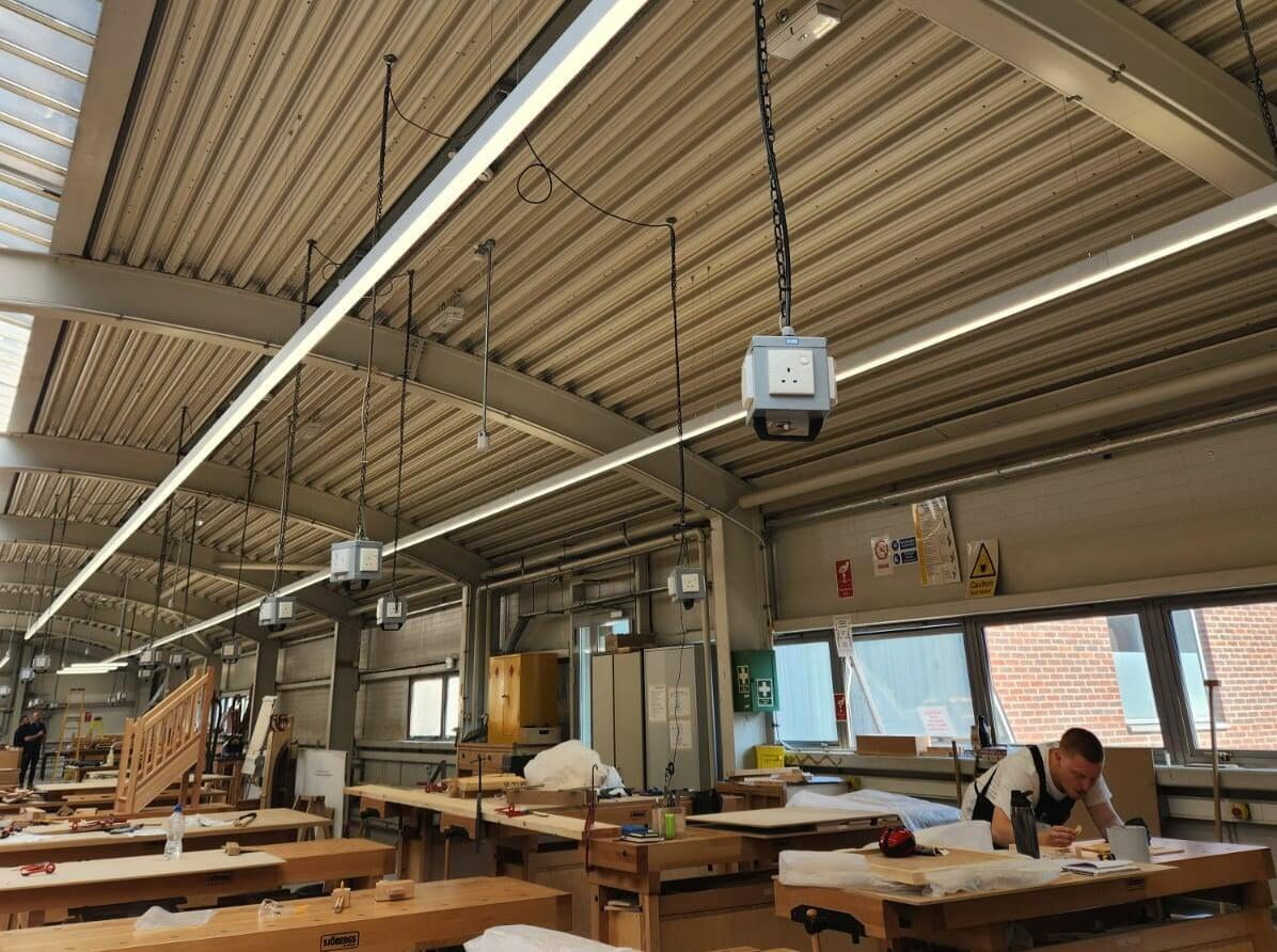 Building Craft College. Old T5 fluorescent lighting was replaced with reclaimed lighting . Wireless casambi controls with wireless sensors to make the lights super efficient. It