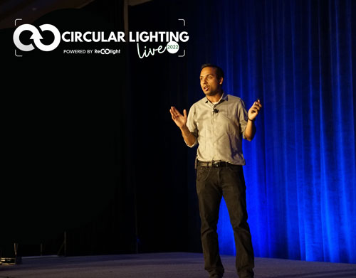 A speaker in front of a blue curtain. Circular Lighting Live 2023 programme is unveiled