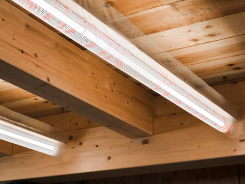In order to minimise the glare effect of the LED linear luminaires, Studio De Schutter covered the underside of this 'light hack' with an industrial fabric made of non-combustible material.