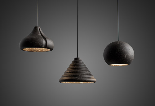 Foscarini has expanded its portfolio of experimental materials with the launch of three pendant lights made from recycled lava.